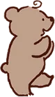 楽しげに立っている小さなグレーのクマ